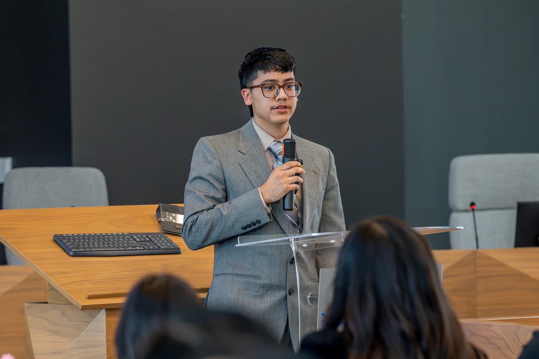 Damian Ramirez presenting at a podium